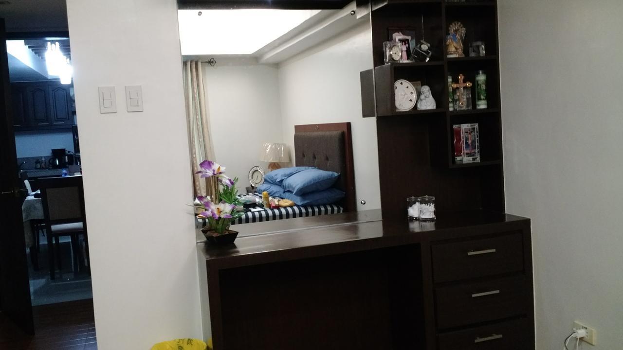Burgundy Mckinley Place Apartment Manila