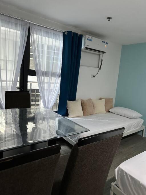Apartment W Projector Wifi Netflix And Pool Access In Adb Tower Ortigas Cbd Manila