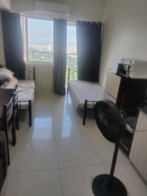 With Two Single Beds And Balcony Facing View Manila