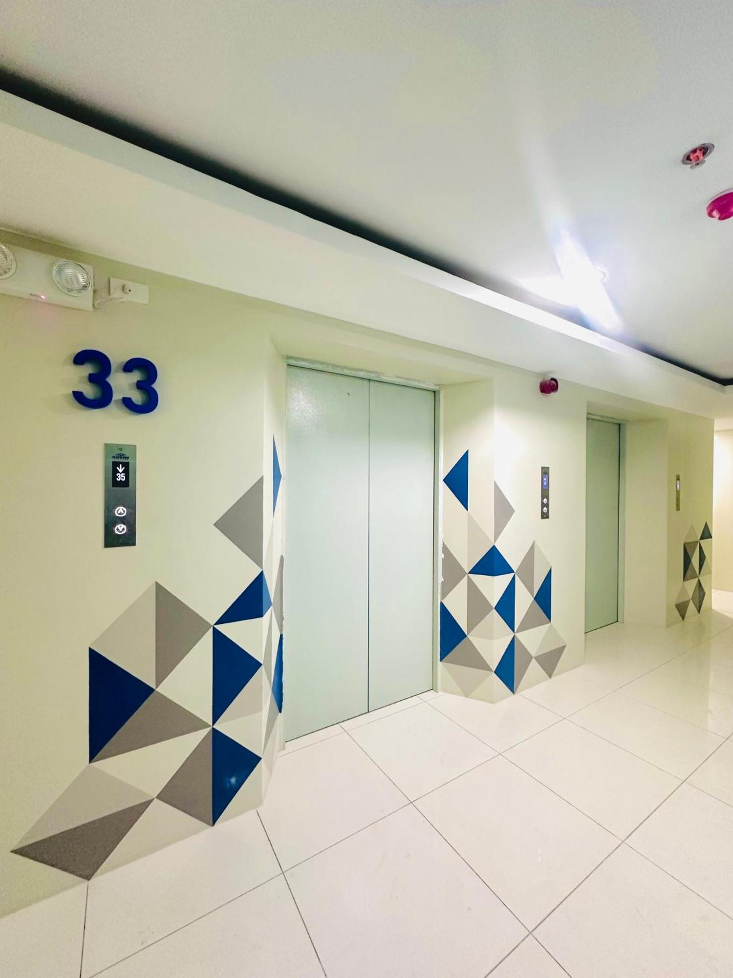 Aparthotel Working In Front Of Ateneo De Manila
