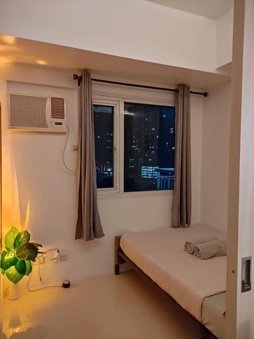Cozynest In Makati Apartment